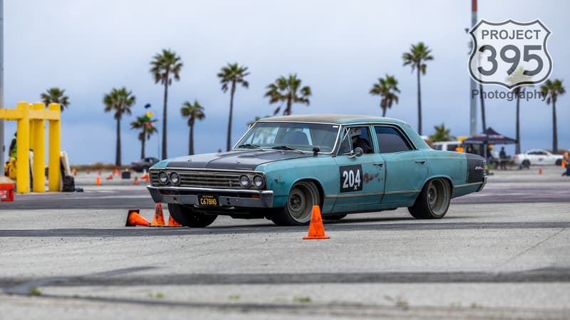 Brian's Crew Cab Chevelle Malibu during an autocross event. Photographed by Photos Project 395 on Instagram and Facebook