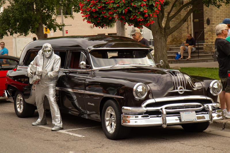 While photographing this Pontiac hearse, a photobombing Elvis snuck into the photo and was just one of many buskers bringing life to the event