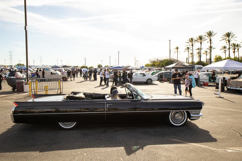 A Cadillac cruising around with a good wide shot of the shows immense size