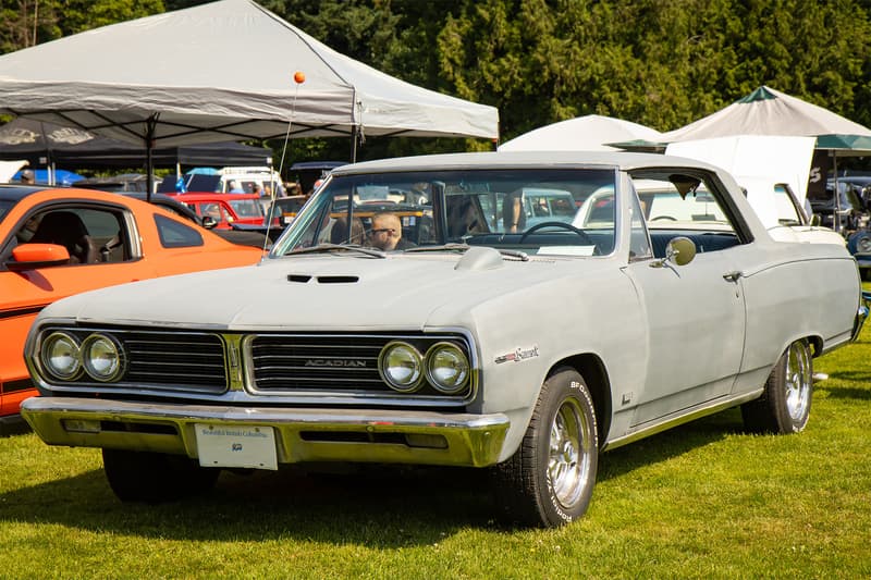 1965 Acadian Beaumont with an aftermarket GTO hood scoop and hood tachometer, added by the owner to continue the Pontiac theme throughout the car