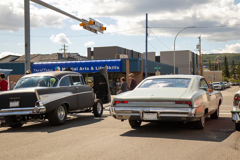 A decade apart, this 1957 Chevrolet and 1967 Pontiac were stopped at the intersection, with the Parisienne awaiting its chance to turn onto Bowness Road