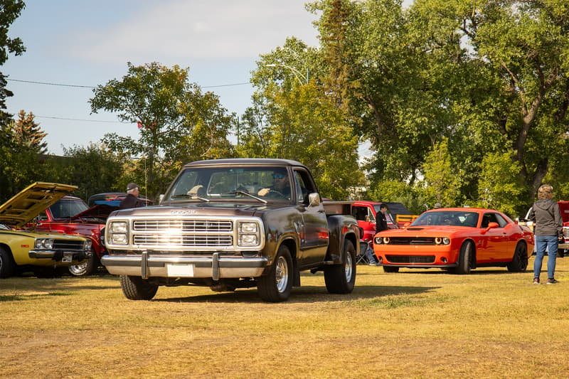 A Dodge stepside and modern Challenger roll into the event together