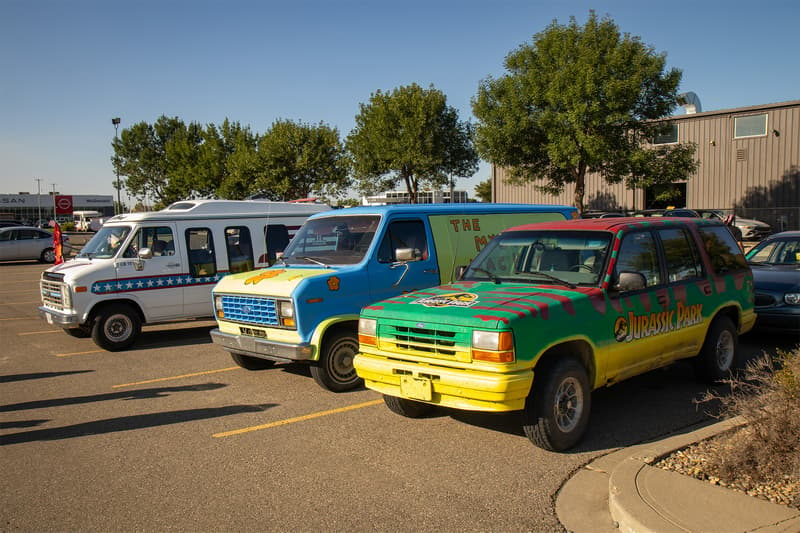 A trio of themed vehicles part of The Great Beater Challenge, including the Mystery Machine and a Jurassic Park Explorer