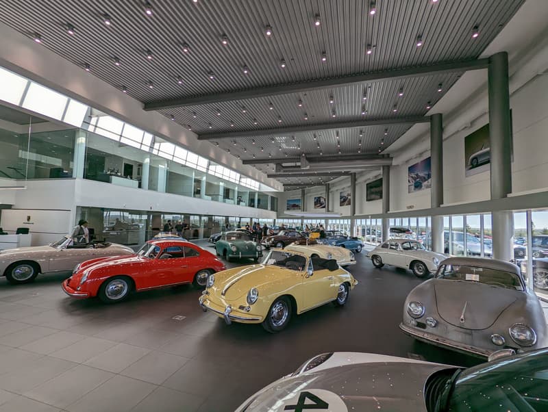 Porsche center Calgary showroom with a dozen 356's