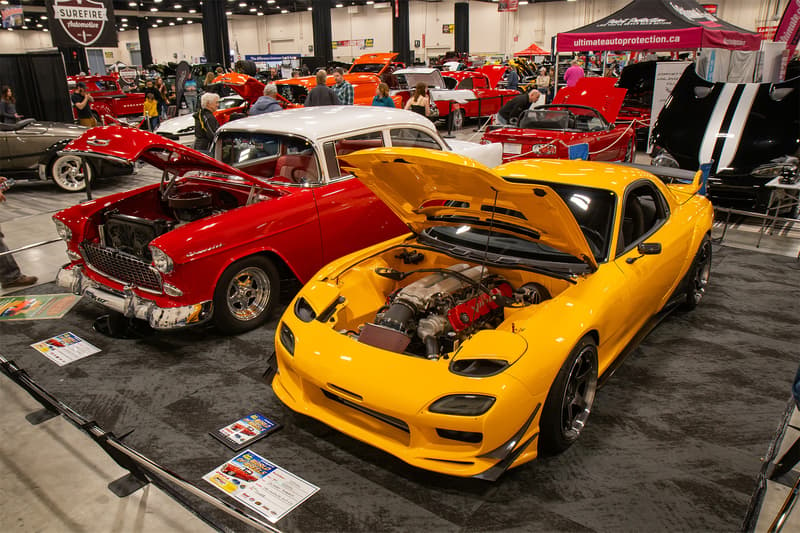 A 1955 Chevrolet and a Viper V10 powered RX-7 sitting side by side during World of Wheels