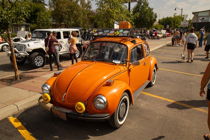 An orange Beetle among the plethora of other classic cars and special interest vehicles during Okotoks Show & Shine