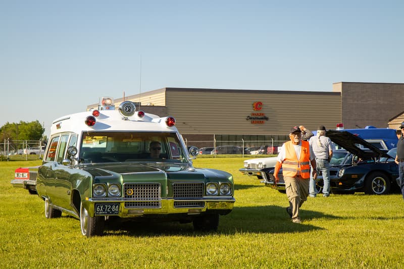 A trio of ambulances entering the Iron Indians Show and Shine