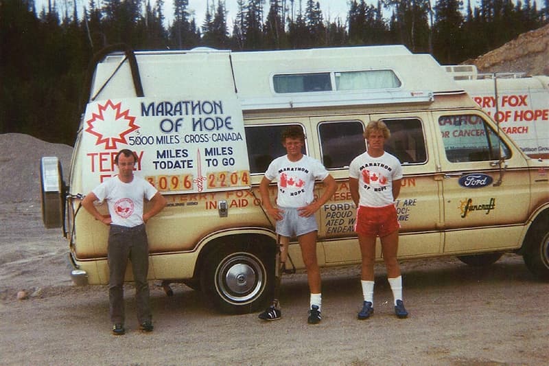 Photograph of Doug Alword, Terry and brother Darrell Fox, posed up with the Van of Hope