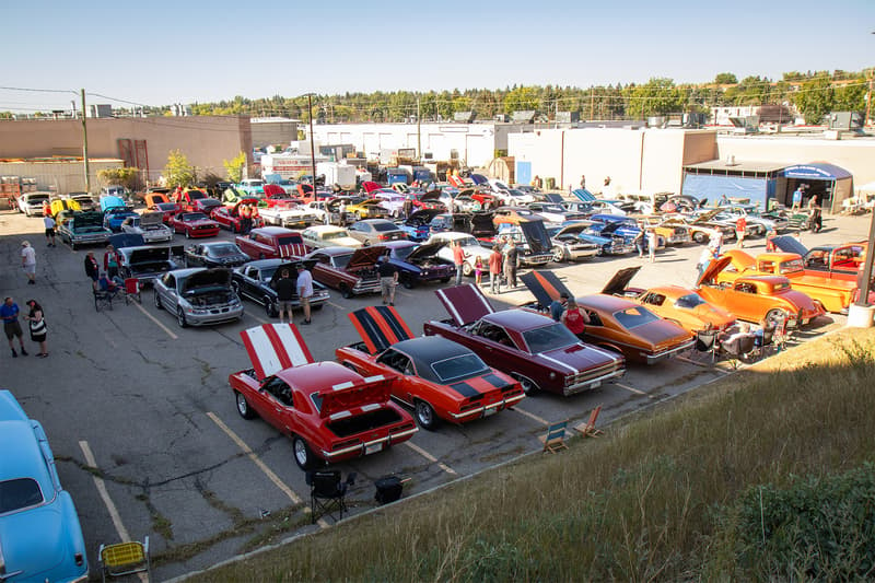 An impressive display from overhead of the large parking lot, filled with all assortments of specialty vehicles