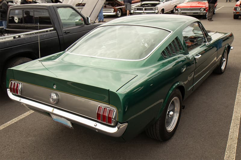Rear of the 1965 Mustang, showcasing the custom Shelby inspired ducktail spoiler added to the rear